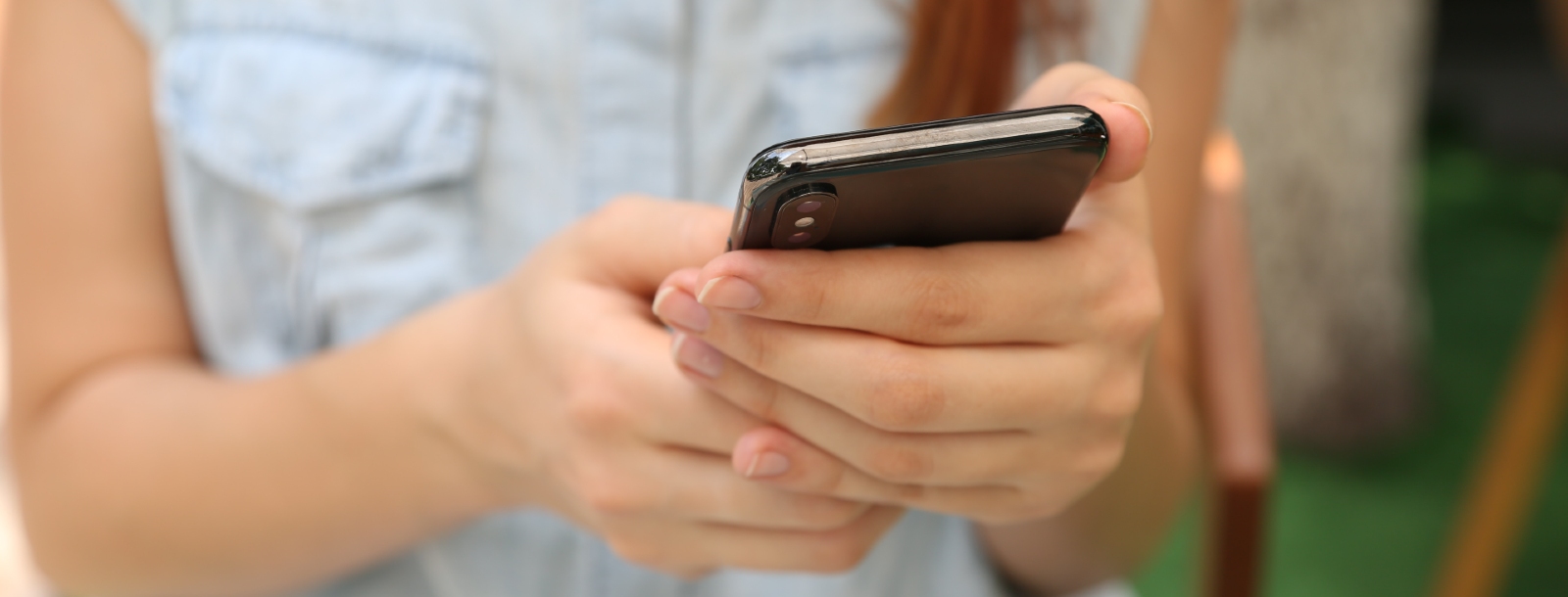 woman scrolling on her mobile phone