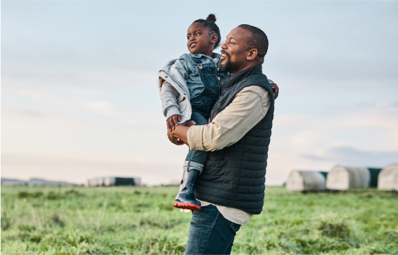 Father and daughter on a farm